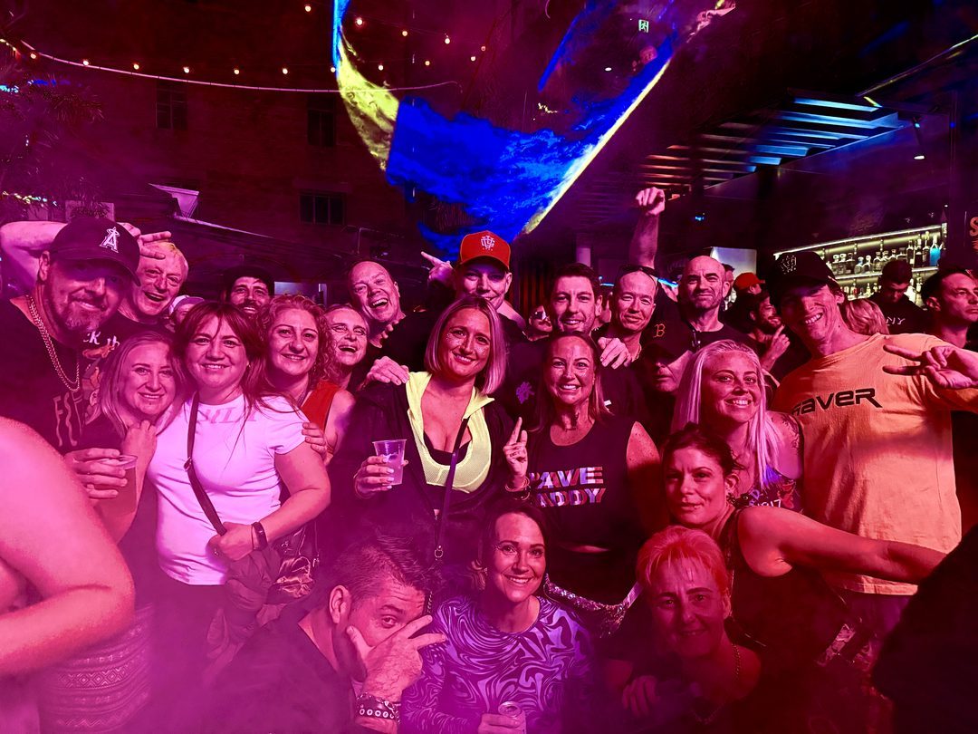 A crowd of regulars posing together at Critical Mass