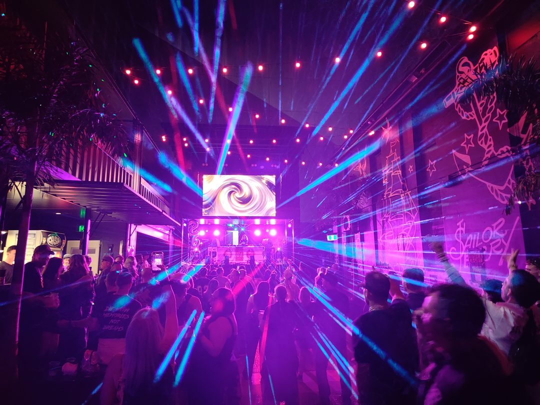 Hands up under lasers and the main screen